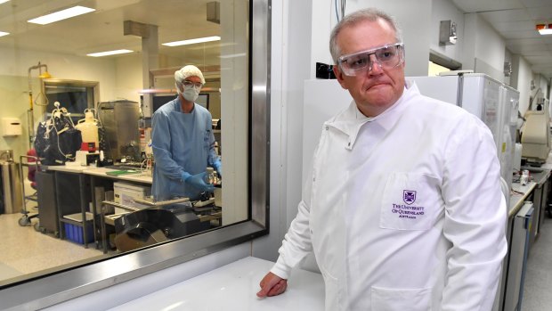 Prime Minister Scott Morrison at the University of Queensland. The vaccine venture had to be abandoned when it was discovered that participants given the trial vaccine started returning false positives for HIV tests.