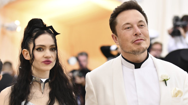 The SEC said Musk came up with the price in attempt to impress his girlfriend, rapper Grimes.