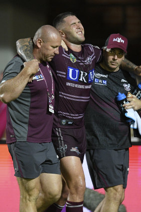 Casualty ward: Curtis Sironen is assisted from the field after sustaining a knee injury.