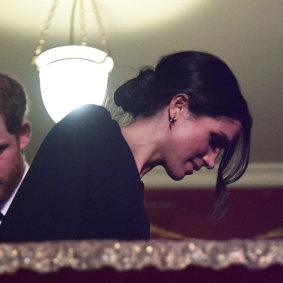Side Bun alert! Prince Harry and Meghan Markle take their seats at the Royal Albert Hall in London for a  concert to celebrate the Queen's 92nd birthday
