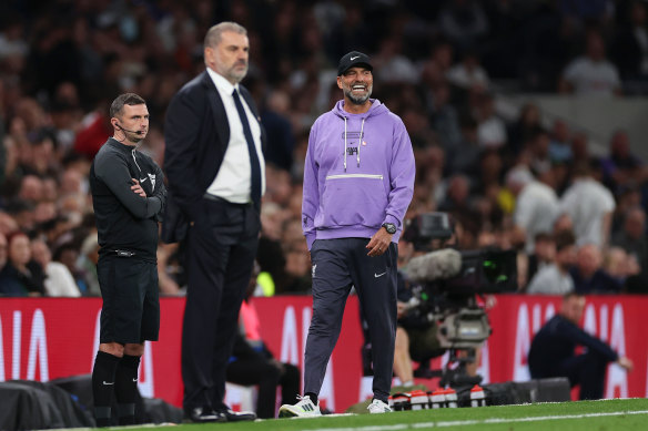 Jurgen Klopp reacts during the match as Ange Postecoglou watches on.