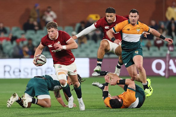 Huw Jones of the British & Irish Lions makes a break during the rugby match between the Lions and the AUNZ Invitational XV 
