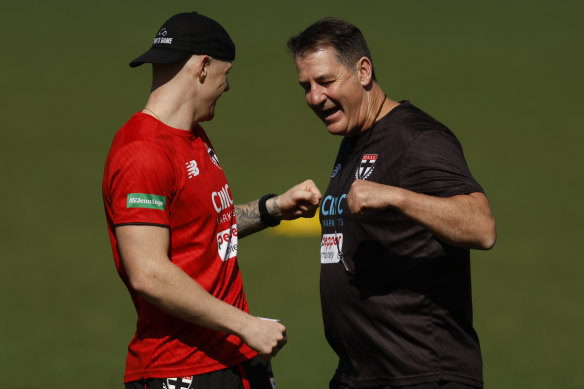 Zak Jones and Ross Lyon share a laugh at a recent St Kilda training session.