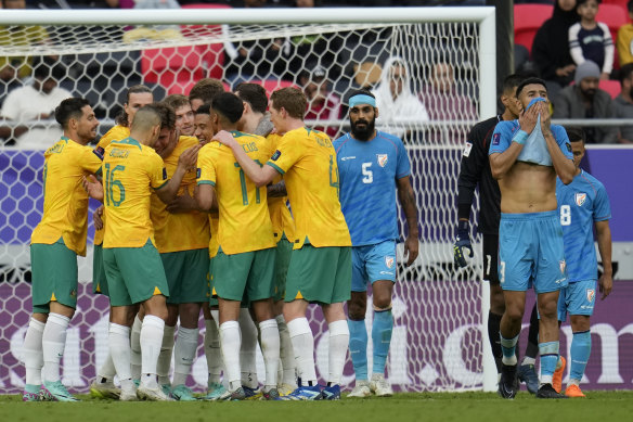 Jordy Bos and the Socceroos celebrate his goal.