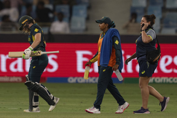 Australian skipper Alyssa Healy leaves the field after retiring hurt during her innings.