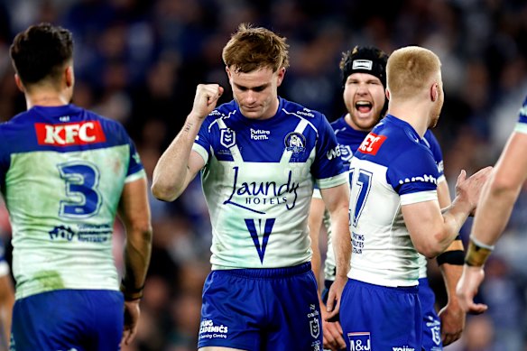 Lachlan Galvin celebrates the Bulldogs win with teammates.