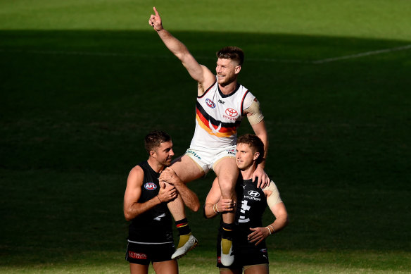 Bryce Gibbs is chaired from the ground by a pair of former teammates.