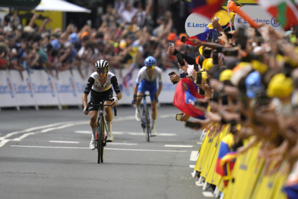 Britain’s Adam Yates, left, pedals followed by his brother Britain’s Simon Yates, on his way to win the first stage of the Tour de France.