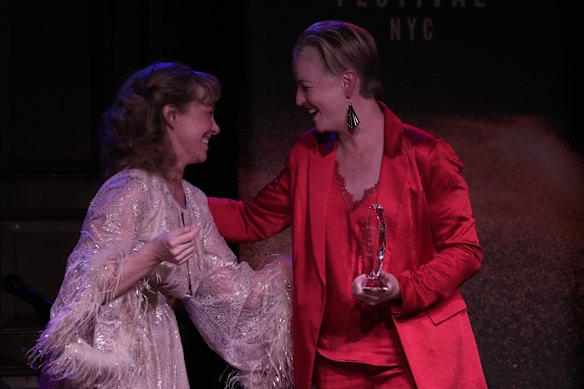 Carmel Dean (right) accepts an award for her contribution to the Australian performing arts scene in New York.