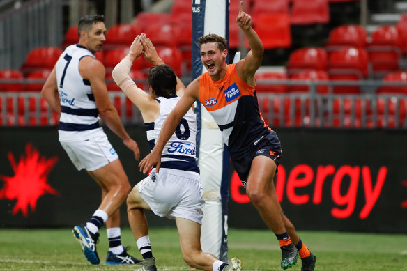 Harry Perryman celebrates a goal in Saturday night's win over Geelong.
