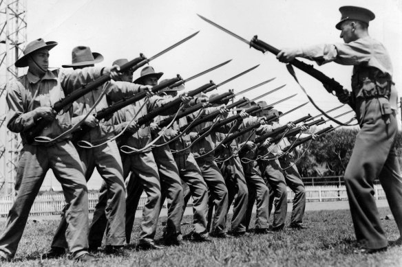 Soldiers in Australia during World War II during a bayonet drill.