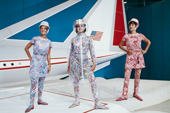 Hostesses model 1970s Pucci uniforms in front of Lockheed's supersonic transport full-size mockup.