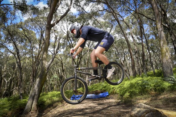 Jakob Salter, recovered from his head injury, takes a jump at his family’s Monbulk property.