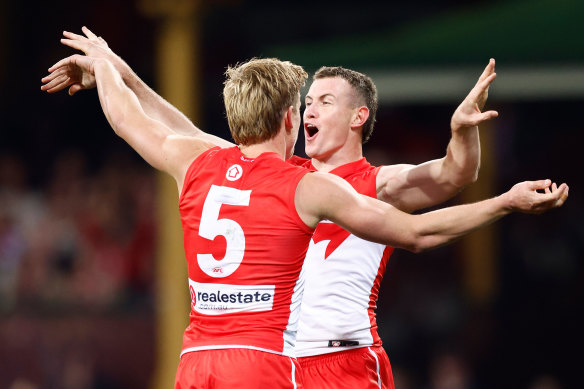 Isaac Heeney and Chad Warner of the Swans celebrate against Collingwood.