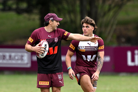 Coach Billy Slater talks tactics with Reece Walsh during a Maroons State of Origin training session in May.