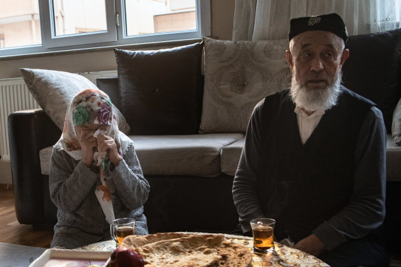 Niaz Abdulla Bostani, right, a religious teacher who moved to Turkey in 2016, and his wife, Hebibihan Merup, in their apartment in Istanbul.