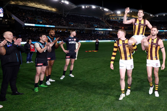 Port’s coach Ken Hinkley (left) had an exchange with James Sicily at this point.