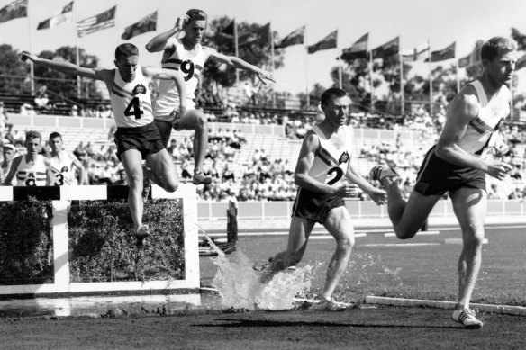 Trevor Vincent (no. 4) of Australia and Maurice (no.9) of England jumping in the steeplechase at the Commonwealth Games in Perth, November 1962.