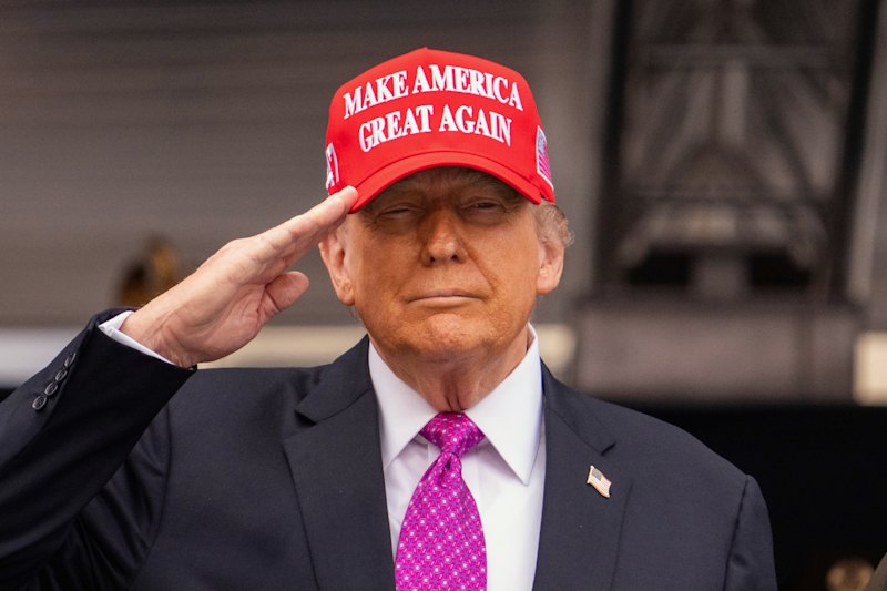Donald Trump speaking at a‍ rally.
