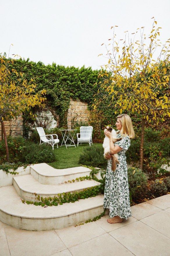 Monique with Leo her Ragdoll cat in the elegant formal rear garden which was designed by Julian Ronchi. 