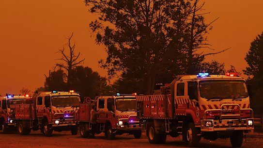 Fire trucks in Buxton as the Green Wattle Creek fire approaches the town.
