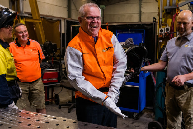 Welding for the cameras at a visit to Opie Manufacturing in Emu Plains. He burnt his finger during the “photo  opportunity”.