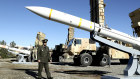 An Iranian general with a domestically built Sayyad-3 missile, in a photo from the Iran’s defence ministry.