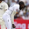 England's Jofra Archer, right, celebrates the dismissal of India's Washington Sundar.