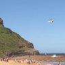 A search is under way for a 15-year-old boy swept off a rock shelf at North Avoca Beach on Tuesday.