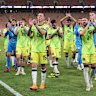 The Socceroos celebrate their win in Saudi Arabia.