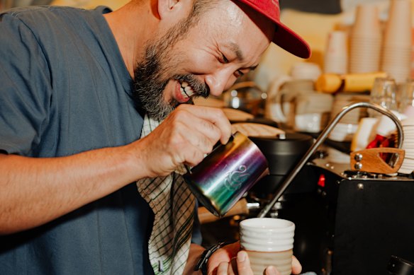 Diggy Doos cafe owner Paul Lee making coffee.