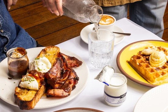 Chickpea pancake with fried eggs and herb salad.