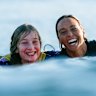 Sally Fitzgibbons with a young local surfer before keeping her season alive at the Bells Beach Pro.