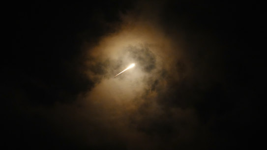 Projectiles fly through the sky in central Israel as a siren sounds a warning of incoming missiles fired from Iran towards Israel.