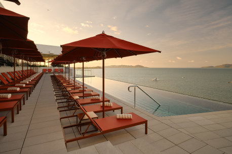 The rooftop pool and bar look across to the Coral Sea and Magnetic Island. 