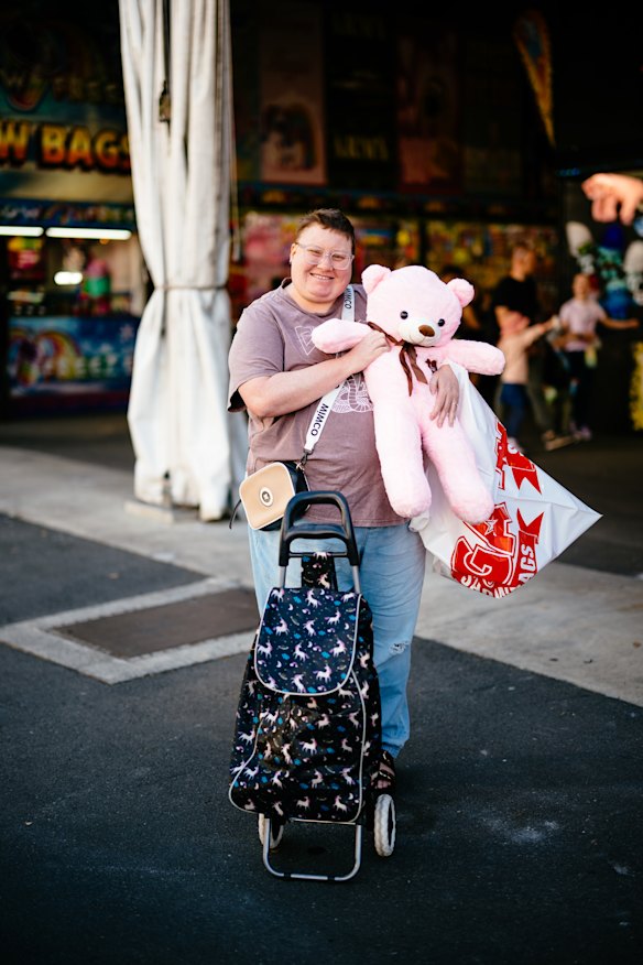 Standing outside the showbag pavilion, Elizabeth Trappett holds a pink bear that she plans to give to her fiance.