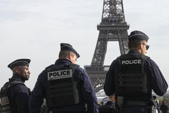 Police officers patrol the Trocadero plaza near the Eiffel Tower in Paris last year.