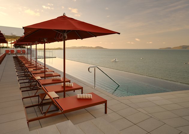 Ardo’s rooftop pool and bar look across to the Coral Sea and Magnetic Island.