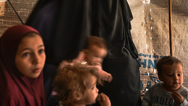 Australian Shayma Assaad (2nd from right) amongst other Australian women and children in al Hawl camp in North East Syria. There are 20 Australian women and 46 Australian children detained in al Hawl camp for their association with Islamic State fighters. They are living in squalid conditions and are afraid of the war that started when Turkey invaded the Kurdish region known as Rojava in North East Syria, Syria, October 21, 2019.