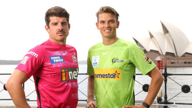 Moises Henriques and Chris Green pose for a photo in Sydney Harbour at the Big Bash launch in November. 