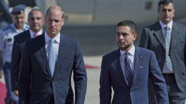 Jordanian Crown Prince Hussein, right, receives Prince William at Marka Airport in Amman.