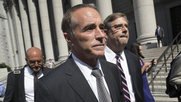 Representative Christopher Collins, a Republican from New York, exits federal court in New York.
