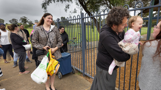 Melton residents wait in line at ADRA Community Care food relief centre.