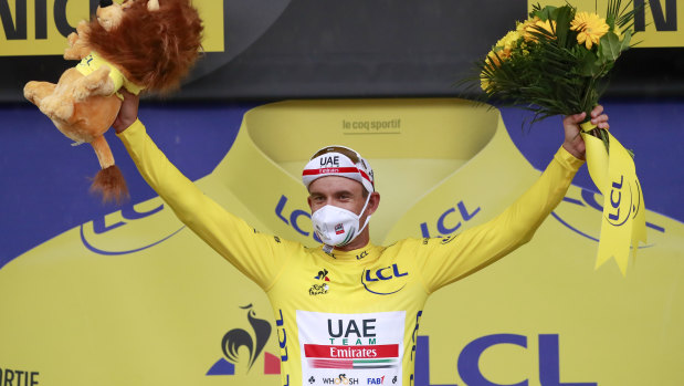 Alexander Kristoff of Norway wearing the overall leader's yellow jersey celebrates on the podium after the first stage of the Tour de France cycling race over 156 kilometers (97 miles) with start and finish in Nice, southern France, Saturday, Aug. 29, 2020. 