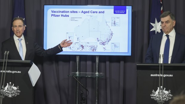 Let the rollout begin: Minister for Health Greg Hunt and Secretary of the Department of Health Professor Brendan Murphy during a press conference on the COVID-19 vaccine rollout on Thursday. 