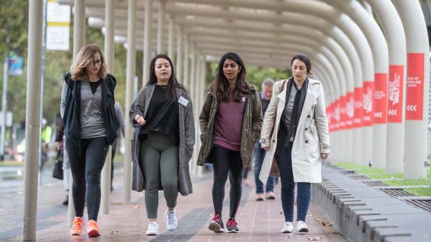 Sheryl Thai (second from left), founder of the League of Extraordinary Women, leads a Mentor Walk. 