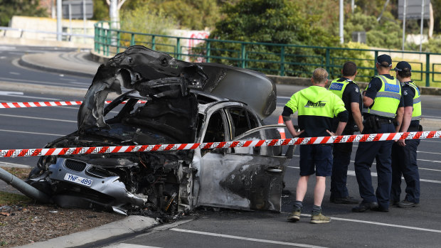 A BMW crashed into a pole and caught fire in Hawthorn. 