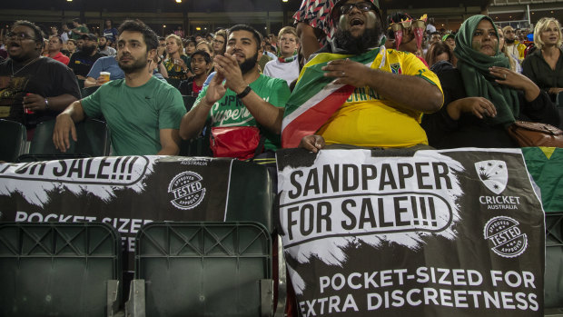 Fans in Johannesburg give the visitors a gentle reminder of their recent past.