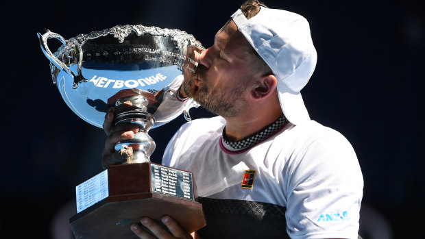 Dylan Alcott savours the prize after winning the quad wheelchair singles final.
