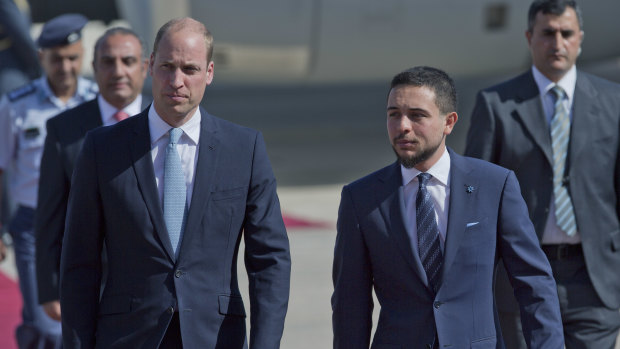 Jordanian Crown Prince Hussein, right, receives Prince William at Marka Airport in Amman.